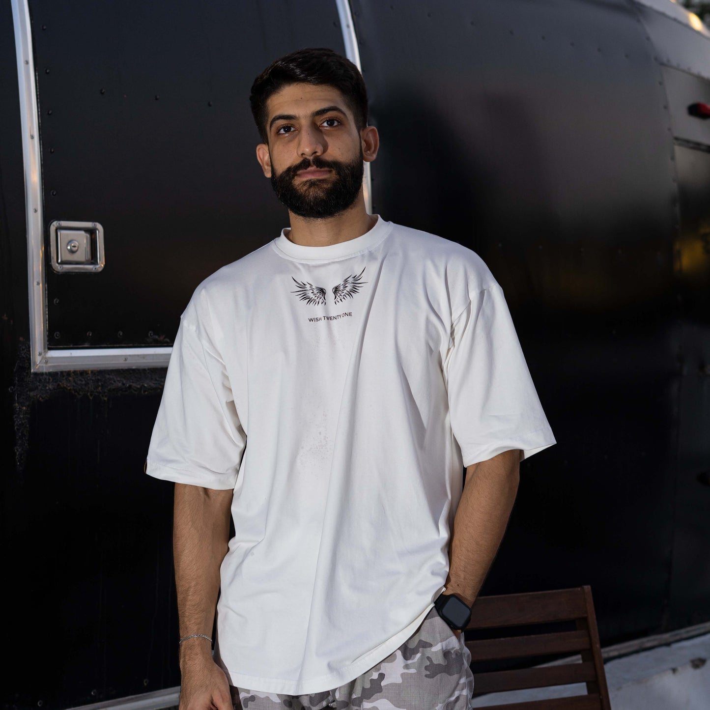 OVERSIZED T-SHIRT , BRAND NAME & WINGS PRINTED ON THE CHEST